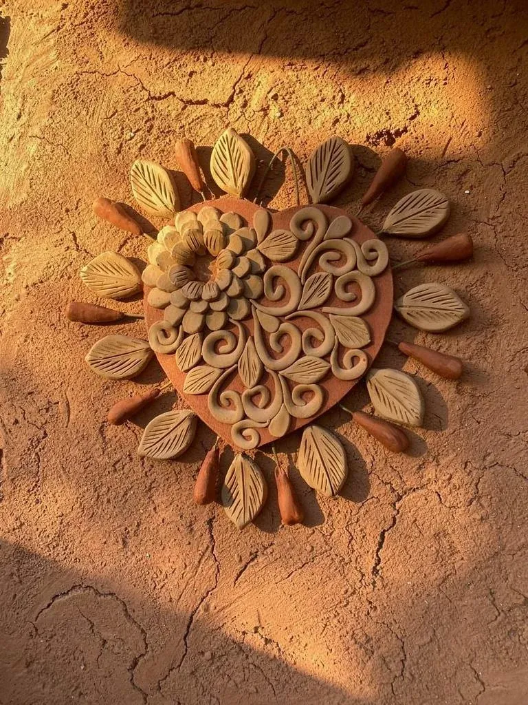 Decorative heart with sculpted floral details