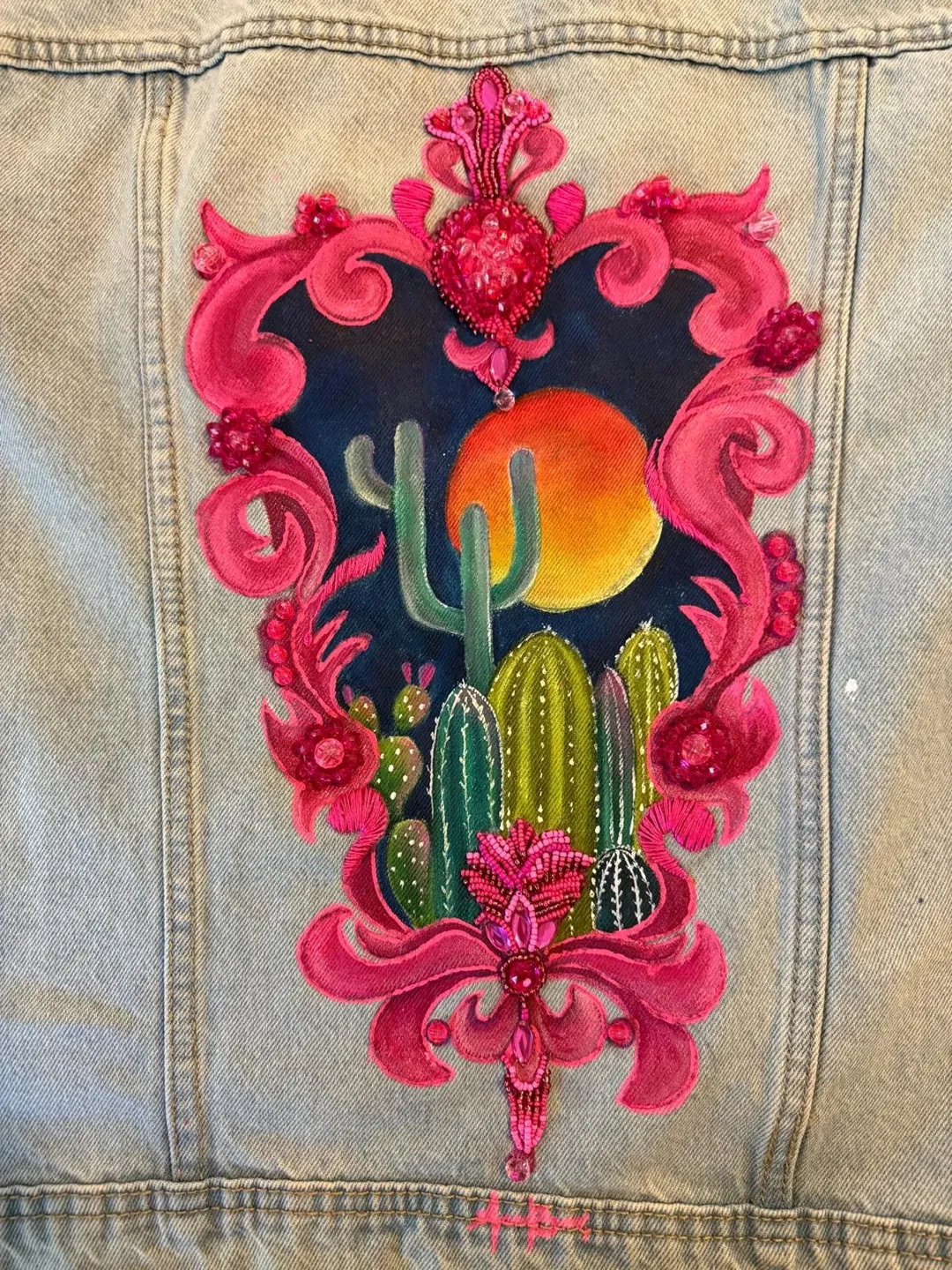 Colorful floral and cactus embroidery on denim
